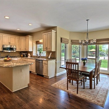 Updated honey oak stained kitchen cabinets painted SW Dover White w/Coffee wash.