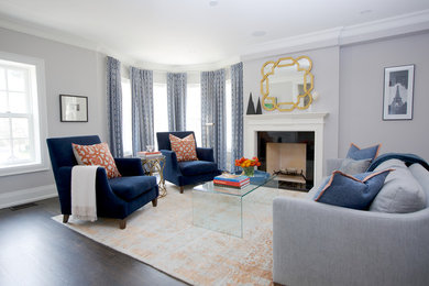 Example of a large transitional formal and enclosed dark wood floor living room design in Toronto with gray walls, a standard fireplace, a stone fireplace and no tv
