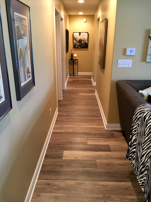 Hallway with Vinyl Floors and Yellow Walls