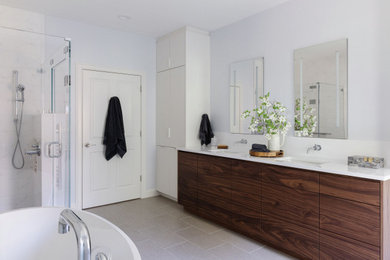 Minimalist porcelain tile bathroom photo in Boston with flat-panel cabinets, dark wood cabinets, an undermount sink, quartz countertops, white countertops and a built-in vanity