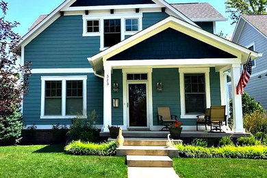 Example of a small arts and crafts blue two-story wood gable roof design in Indianapolis with a shingle roof