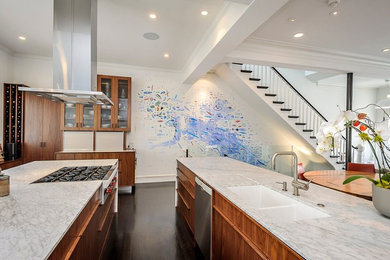 Large minimalist l-shaped dark wood floor enclosed kitchen photo in San Francisco with medium tone wood cabinets, two islands, an undermount sink, flat-panel cabinets, marble countertops and stainless steel appliances