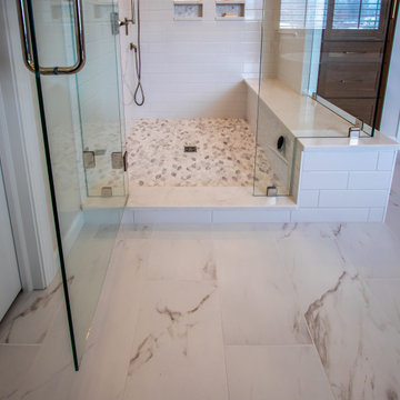 Luxury Spa Bathroom with Natural Warm Vanities, Quartz Countertop, Tiled Shower