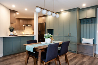 Example of a small transitional vinyl floor and brown floor kitchen/dining room combo design in Vancouver