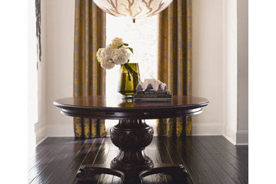 Inspiration for a mid-sized timeless dark wood floor and brown floor hallway remodel in Omaha with beige walls