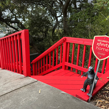 The vibrant red finish gives the restored outdoor structure a clean, unified and