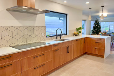 Inspiration for a large modern u-shaped open concept kitchen remodel in Seattle with flat-panel cabinets, medium tone wood cabinets, quartz countertops, a peninsula and white countertops