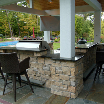Bluestone pool decks, arbors, fireplaces, outdoor kitchen & pavilion