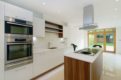Elegant kitchen photo in Surrey