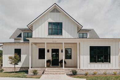 Example of a farmhouse exterior home design in Other