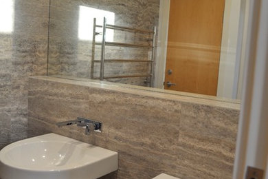 This is an example of a large modern master bathroom in Perth with gray tile.