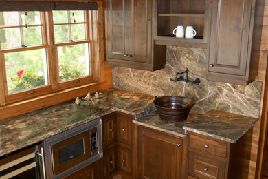 Kitchen - rustic kitchen idea in Minneapolis with beaded inset cabinets, dark wood cabinets, marble countertops and stainless steel appliances