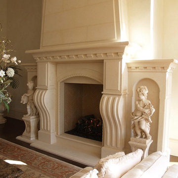 Tuscan hand-carved stone fireplace with an overmantel.