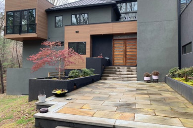 Example of a huge trendy concrete floor basement design in Atlanta with multicolored walls
