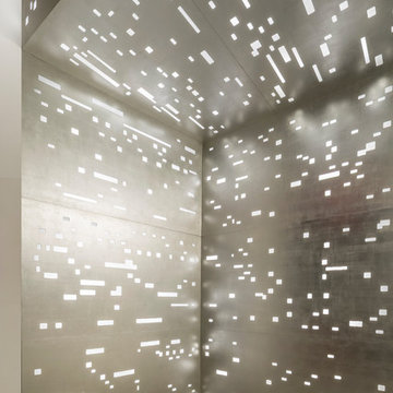 Corner lobby detail showing gilded light panels
