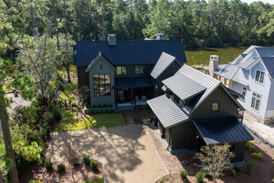 Example of a beach style home design design in Other