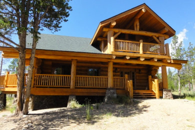 Mountain style two-story wood exterior home photo in Denver