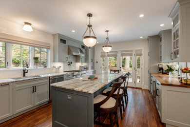 Inspiration for a large timeless l-shaped ceramic tile and brown floor eat-in kitchen remodel in Boston with a drop-in sink, recessed-panel cabinets, gray cabinets, quartzite countertops, white backsplash, marble backsplash, stainless steel appliances, an island and multicolored countertops