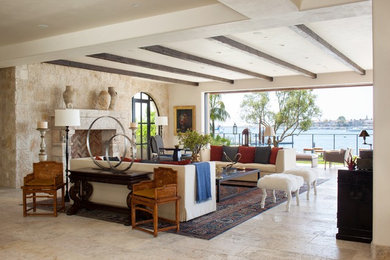 Example of a trendy family room design in Orange County with a stone fireplace