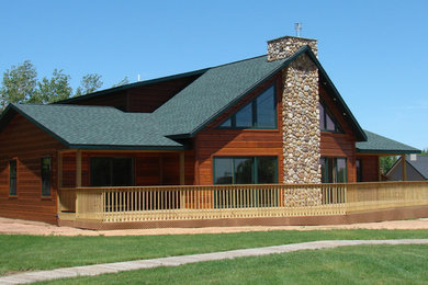 Example of a country exterior home design in Milwaukee