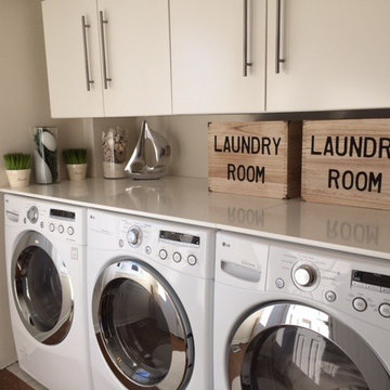 Super efficient 2 Washer and Dryer Laundry Room.