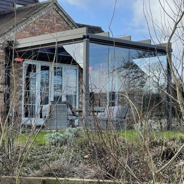 Sunroom With Sliding Doors And Louvered Roof Project In Leesburg, VA
