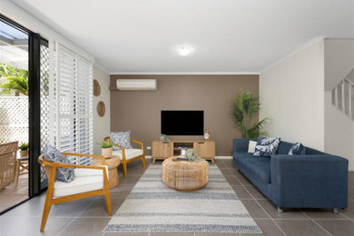 This is an example of a beach style living room in Sunshine Coast.