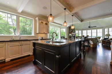 Example of a mid-sized arts and crafts galley medium tone wood floor eat-in kitchen design in Toronto with an undermount sink, recessed-panel cabinets, light wood cabinets, laminate countertops, black backsplash, stone tile backsplash, stainless steel appliances and an island