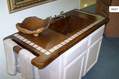 Inspiration for a bathroom in New Orleans with concrete benchtops.