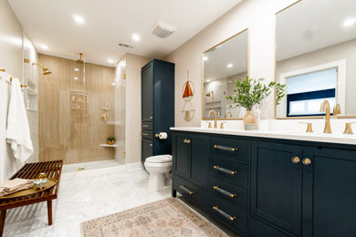 Mid-sized transitional master beige tile and ceramic tile marble floor, double-sink, white floor and wainscoting bathroom photo in Dallas with shaker cabinets, blue cabinets, quartz countertops, white countertops, a freestanding vanity, beige walls, an undermount sink and a niche