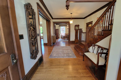Example of a transitional dark wood floor foyer design in Grand Rapids