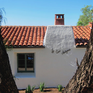 Historic Spanish style fireplace chimney with new Terra Cotta Clay chimney pot