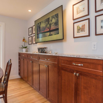 Modern Kitchen with White Flat Panel Shaker Cabinets & Natural Stone Backsplash