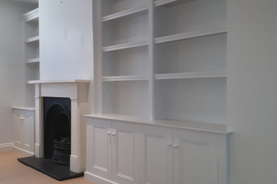 Alcove units either side of fireplace