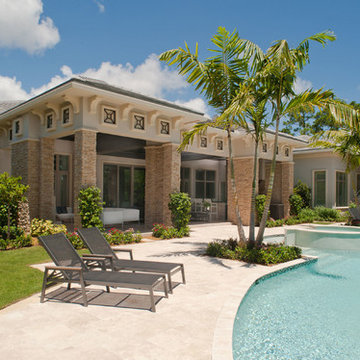 Tropical Style Patio with Stone Pillars and Pool