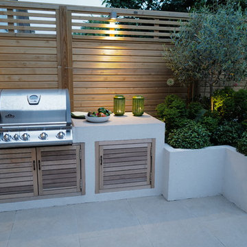 The outdoor kitchen with built in storage and porcelain worktops