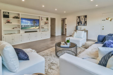 Mid-sized country open concept living room in Los Angeles with white walls, light hardwood floors and grey floor.