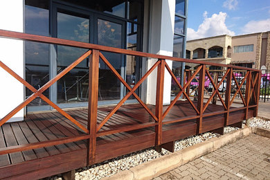 Example of an arts and crafts deck design in Other