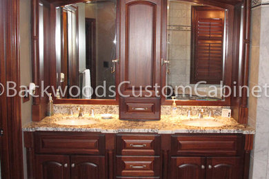 Example of a mid-sized trendy master porcelain tile and brown floor bathroom design in Kansas City with raised-panel cabinets, medium tone wood cabinets, granite countertops and an undermount sink