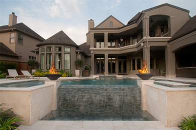 Pool - mid-sized modern backyard l-shaped pool idea in Houston with decking