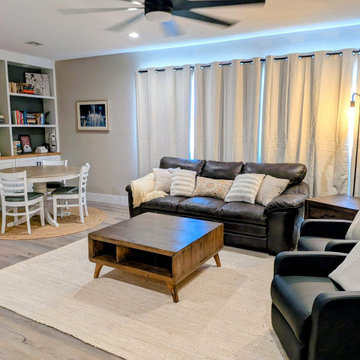 Family Room with Built-In Shelving and LED Lighting