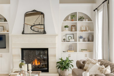 Inspiration for a large timeless formal and open concept light wood floor, brown floor and exposed beam living room remodel in Calgary with gray walls and a standard fireplace