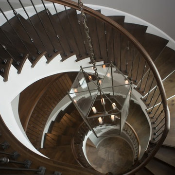 Custom Circular 3-Story Walnut Stair With Iron BalustersS