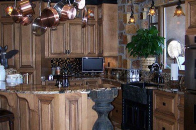 Example of a mountain style kitchen design in Other with raised-panel cabinets, brown cabinets and granite countertops