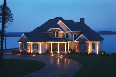 Mid-sized elegant beige vinyl exterior home photo in St Louis