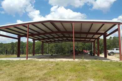 Large modern one-story metal exterior home idea in Other with a gambrel roof and a metal roof