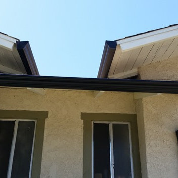 Triple Curve Rain Gutter in Black Aluminum.