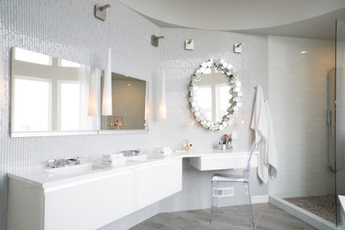 Large trendy master blue tile and glass tile porcelain tile doorless shower photo in Portland with flat-panel cabinets, white cabinets, an undermount tub, a two-piece toilet, blue walls, an undermount sink and quartz countertops