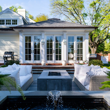 Brick and bluestone patio with foundation focal point.