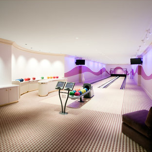 Inspiration for an expansive contemporary fully buried basement in Chicago with purple walls, carpet and no fireplace.